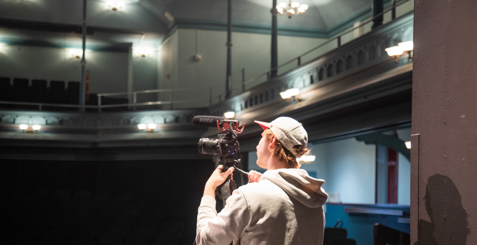 Gavin McLean documenting the interior of Music Hall. 