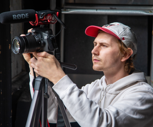 Gavin McLean videotapes Wisconsin Film Festival Volunteers. 