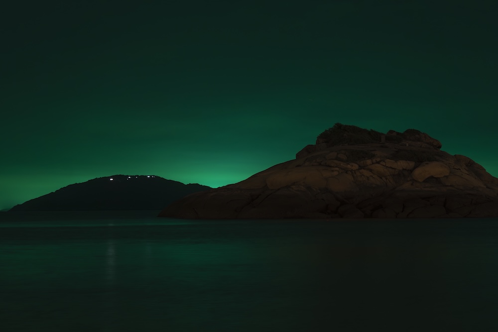 The silhouette of an island in the distance.
